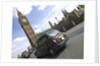 Taxi on road with big ben in background, London by Assaf Frank